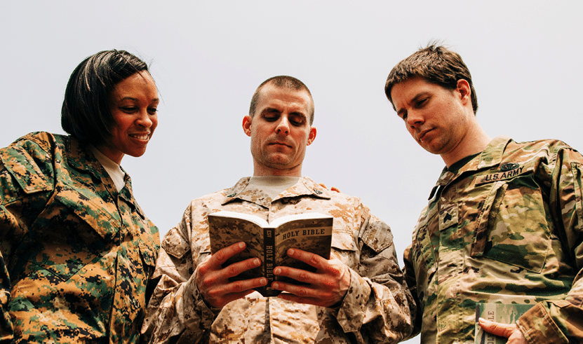 Soldiers reading the bible together