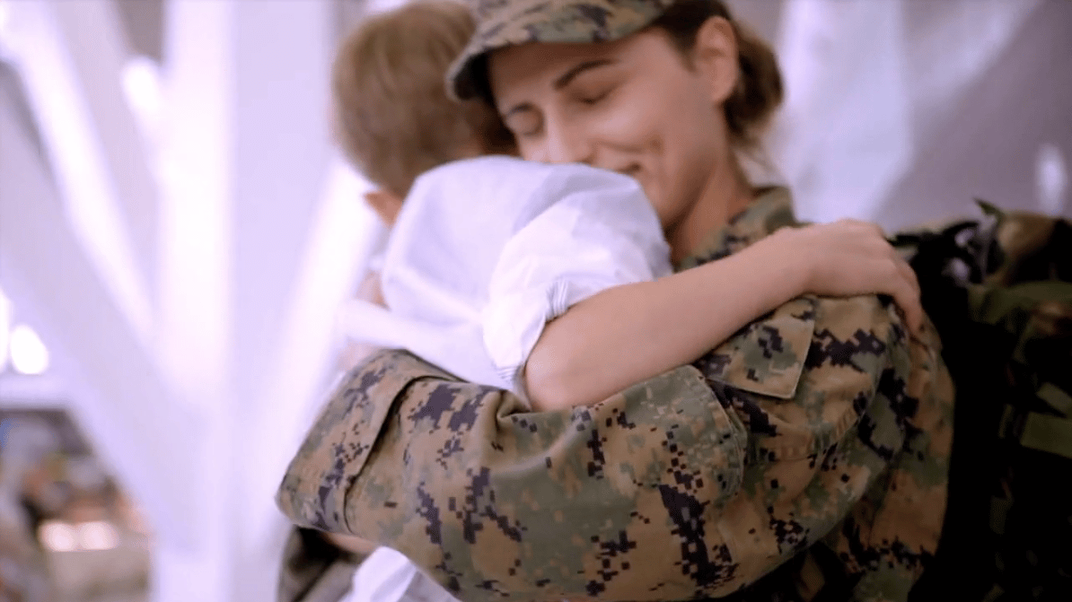 Military Mom hugs child